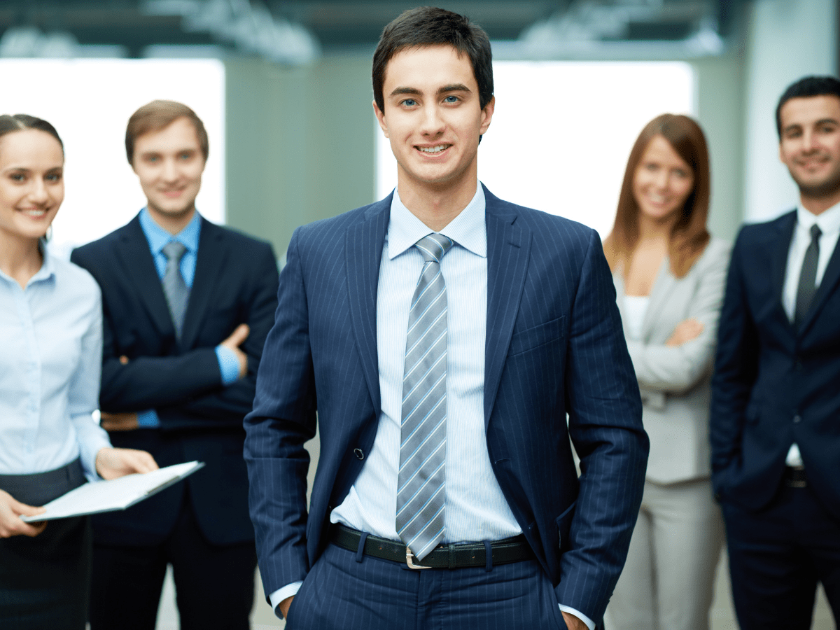 Business leader with team behind